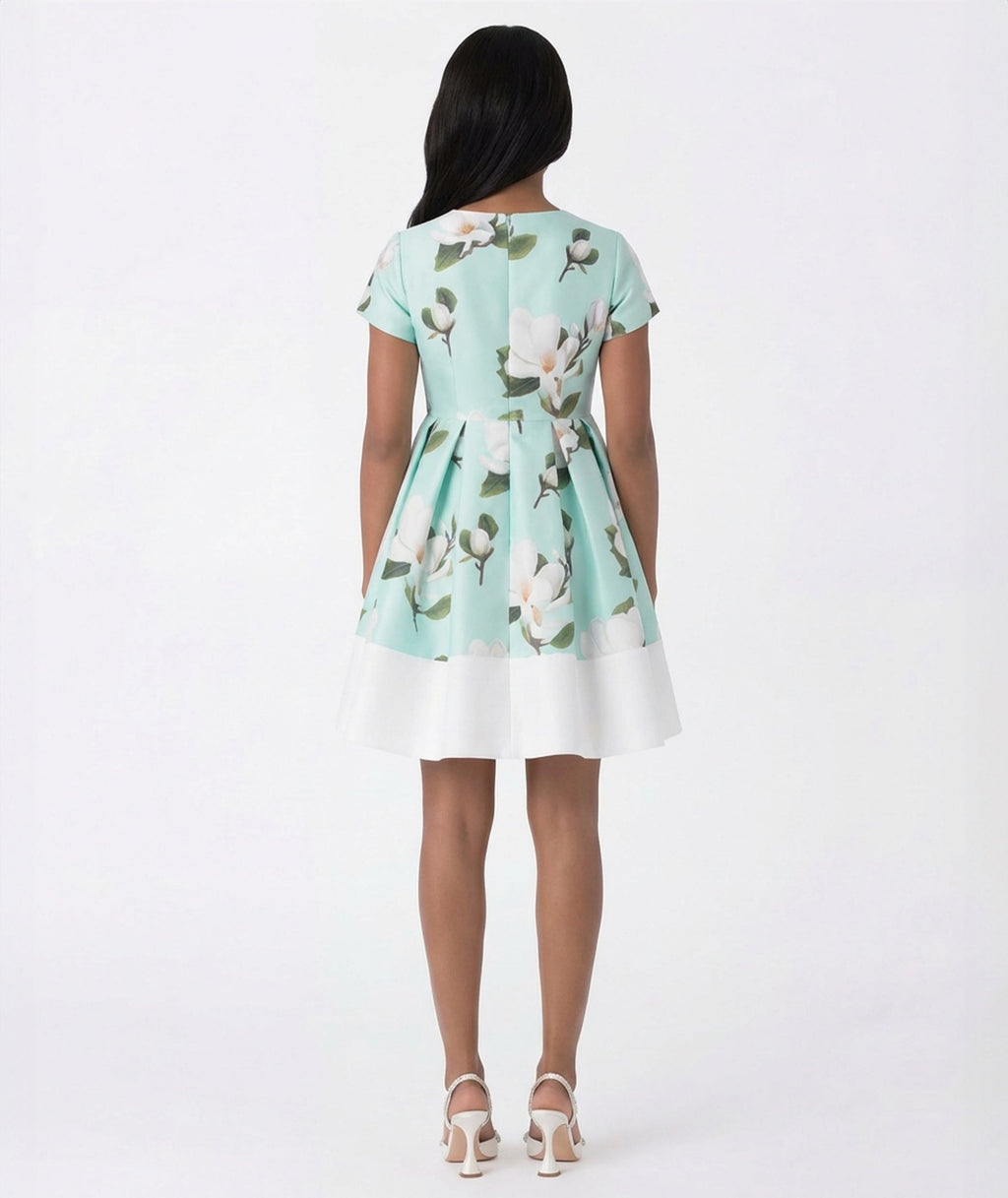 Woman wearing a floral dress with a white background