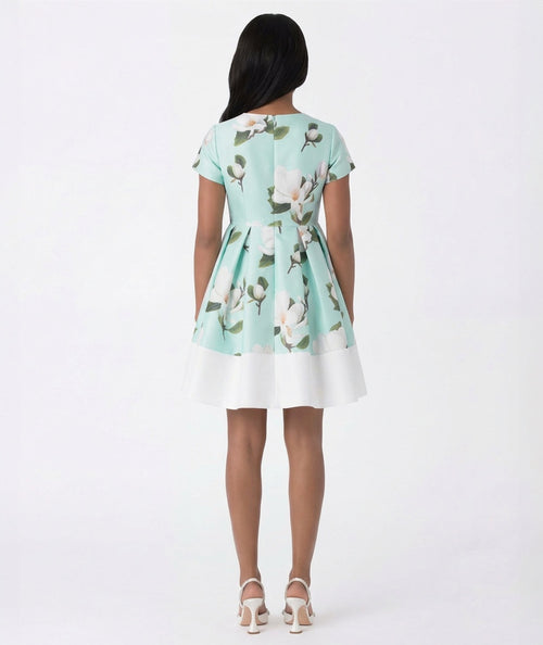 Woman wearing a floral dress with a white background