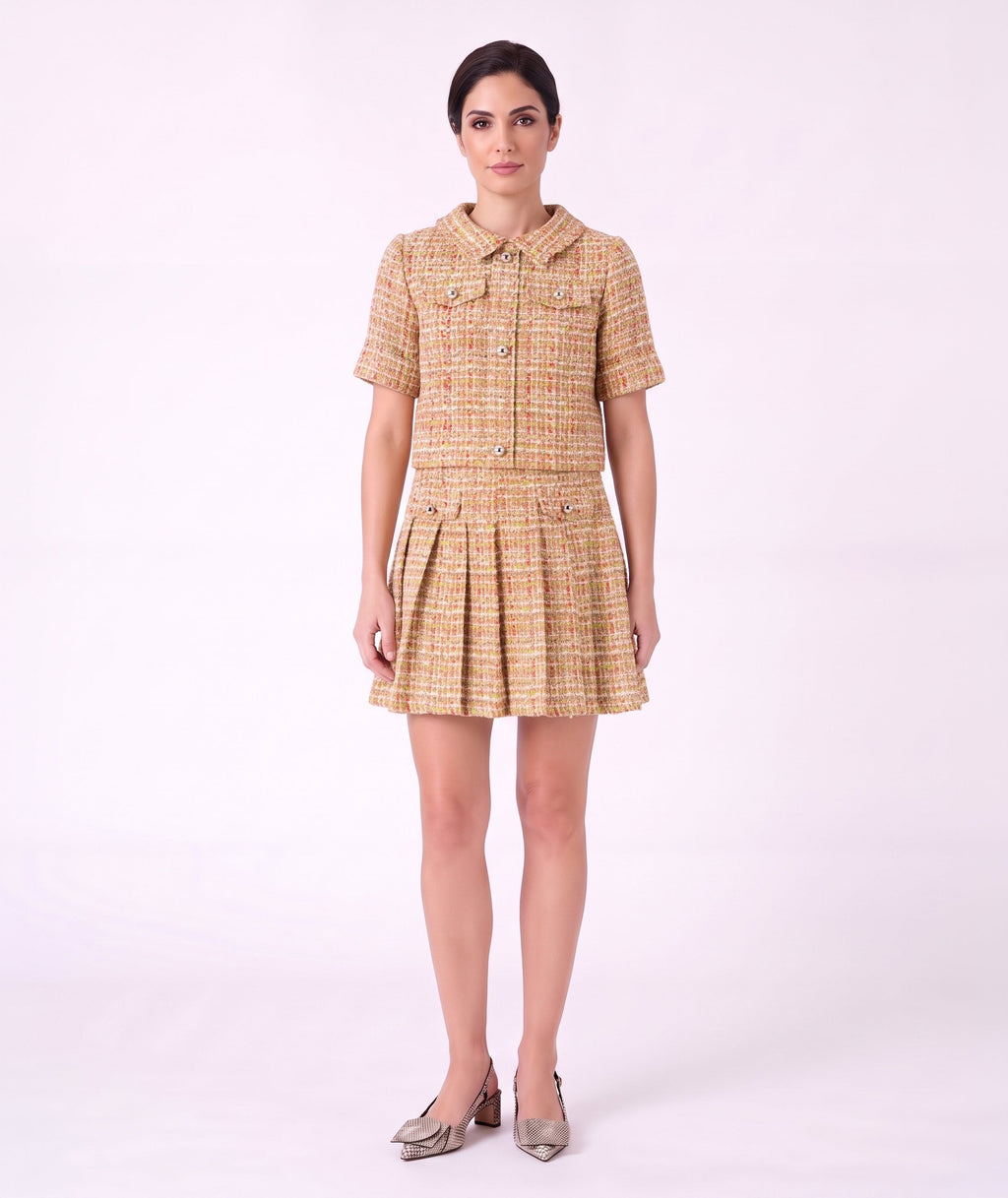 Front view of Mama Luma Crystal Tweed Women's Outfit featuring a short-sleeve tweed top and matching pleated skirt.