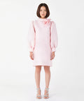 Front view of Mama Luma’s blush pink women’s dress featuring a sculptural rose neckline and voluminous long sleeves. Designed for Mommy & Me matching looks, this elegant satin piece is ideal for Christmas parties, family gatherings, and winter celebrations. Available in sizes XS–XL.
