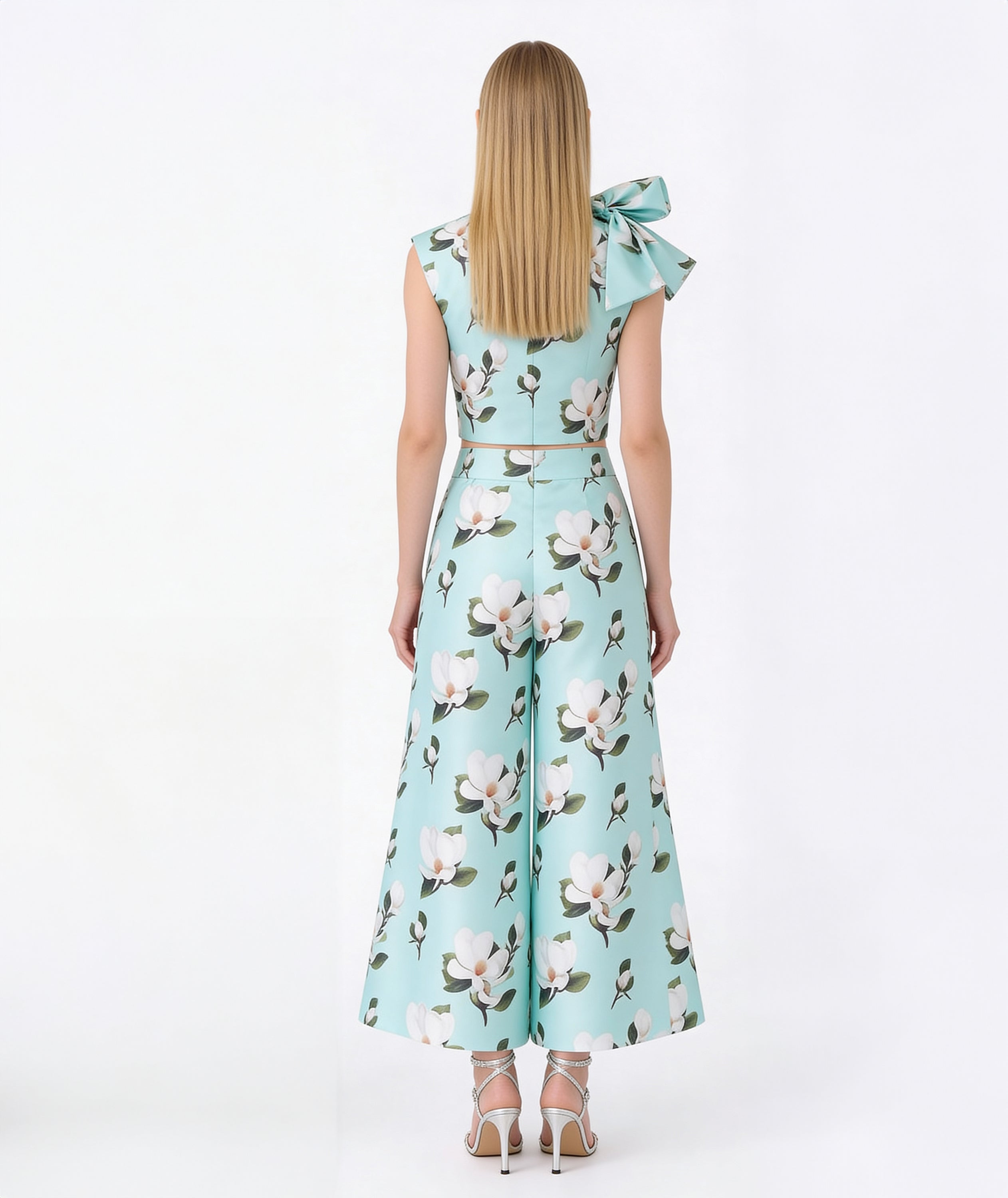 Woman wearing a floral dress with a white background