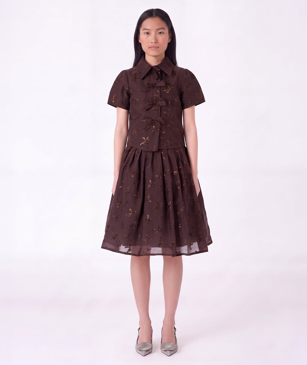 Front view of Shimmering Mocha Women's Outfit featuring a structured bow-detailed top and matching gathered midi skirt by Mama Luma.