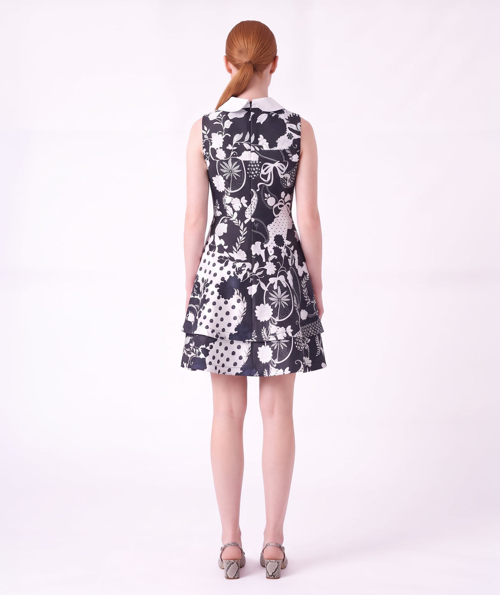 Back view of the Suva Maia Collared Women’s Dress featuring a navy and ivory botanical print, contrast collar, and structured silhouette by Mama Luma.