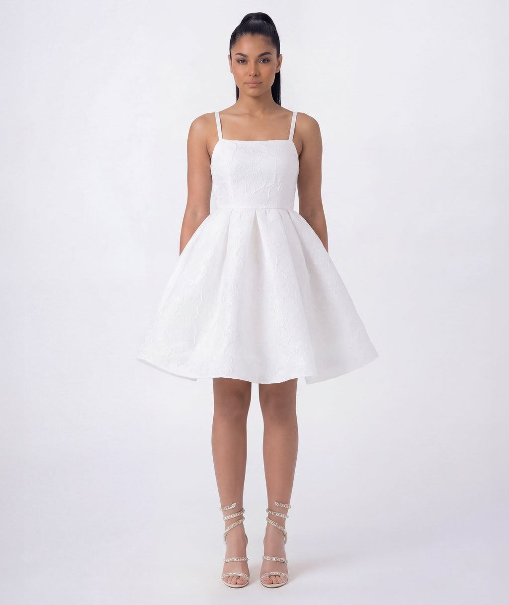 Elegant white textured jacquard dress featuring structured bodice and flared silhouette